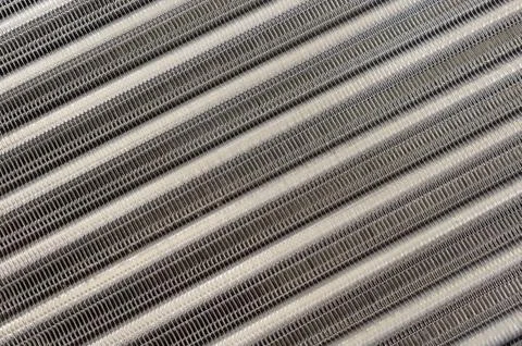 Details of the car engine radiator. Macro close-up of the radiator plates. Stock Photos