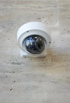 Details with a CCTV camera on a wall inside a building. Stock Photos