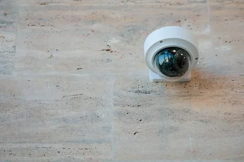 Details with a CCTV camera on a wall inside a building. Foto stock
