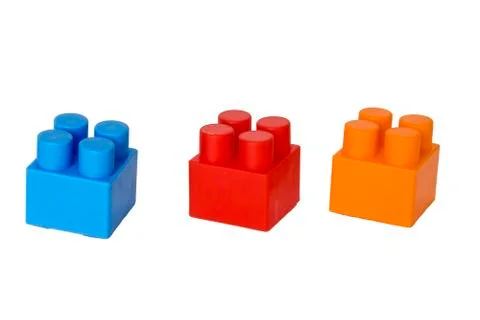 Details of a children's plastic constructor on a white background. colored cu Stock Photos
