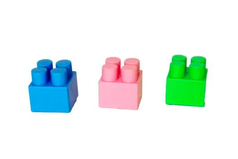 Details of a children's plastic constructor on a white background. colored cu Foto stock