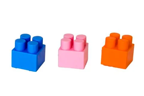 Details of a children's plastic constructor on a white background. colored cu 库存照片