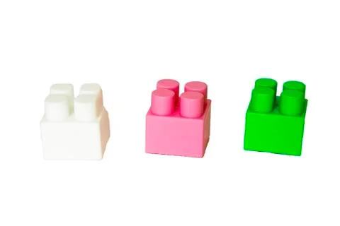 Details of a children's plastic constructor on a white background. colored cu Foto stock