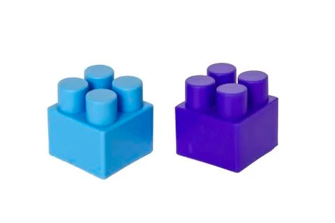 Details of a children's plastic constructor on a white background. colored cu Stock Photos