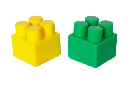 Details of a children's plastic constructor on a white background. colored cu Stock Photos