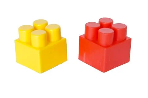 Details of a children's plastic constructor on a white background. colored cu Stock Photos