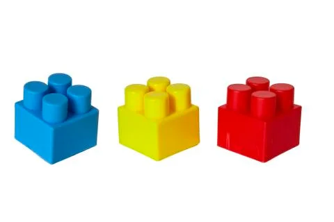 Details of a children's plastic constructor on a white background. colored cu Stock Photos