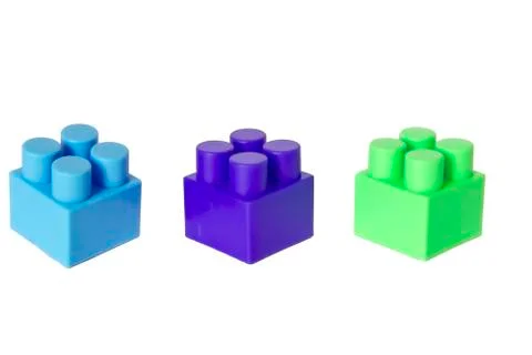 Details of a children's plastic constructor on a white background. colored cu Stock Photos