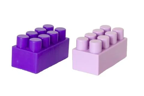 Details of a children's plastic constructor on a white background. colored cu Stock-Fotos