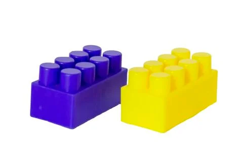 Details of a children's plastic constructor on a white background. colored cu Stock Photos
