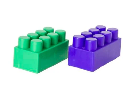 Details of a children's plastic constructor on a white background. colored cu Stock Photos