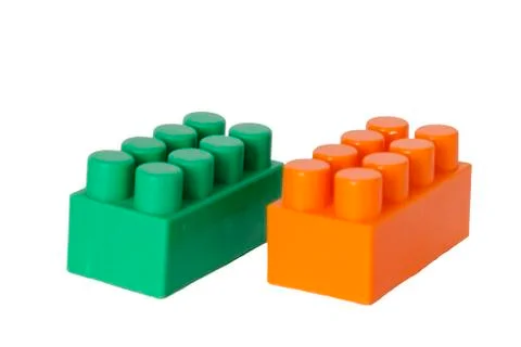 Details of a children's plastic constructor on a white background. colored cu Foto stock