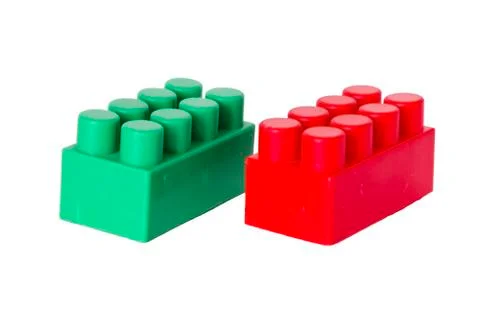 Details of a children's plastic constructor on a white background. colored cu Stock-Fotos