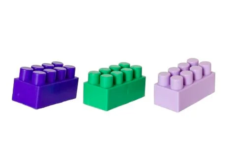 Details of a children's plastic constructor on a white background. colored cu Stock Photos