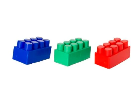 Details of a children's plastic constructor on a white background. colored cu Stock Photos