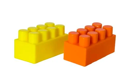 Details of a children's plastic constructor on a white background. colored cu Stock Photos