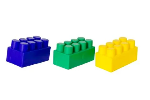 Details of a children's plastic constructor on a white background. colored cu Stock Photos