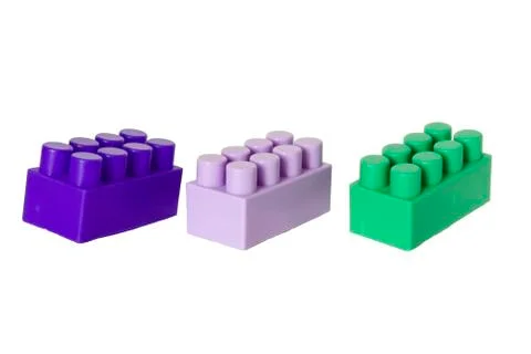 Details of a children's plastic constructor on a white background. colored cu Stock Photos