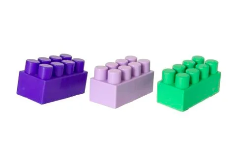 Details of a children's plastic constructor on a white background. colored cu Stock Photos