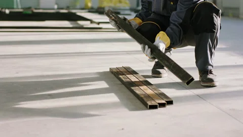 Details closeup at construction site working hard one of worker using protective Stock Footage 170142296
