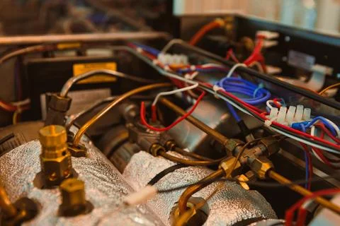 Details of complex wires and components inside a mechanical system in a wor.. Stock Photos