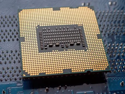 Details of a computer board with microchip as concept background Stock Photos