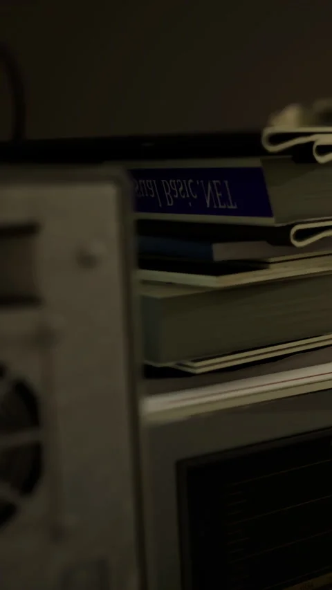 Details of a computer setup in a workspace during evening hours Stock Footage 336572846