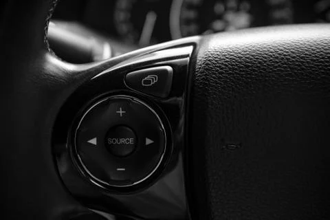 Details of controller bottons on steering wheel of modern car Stock Photos