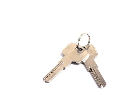 Details of key ring with various door and car keys against a white background Stock Photos
