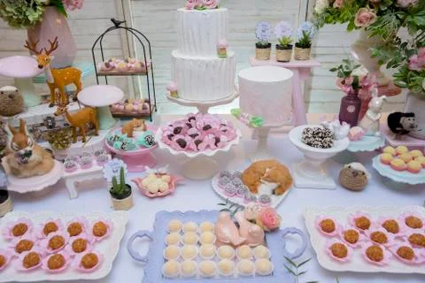 Details of luxurious table of sweets and birthday cake Stock Photos