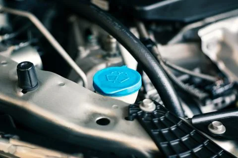 Details of modern car engine, windshield washer tank sign on cap Stock Photos