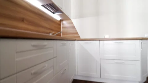 Details of a modern light kitchen in motion . View of the bright kitchen Video stock 141004644