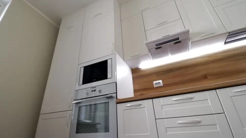 Details of a modern light kitchen in motion . View of the bright kitchen Video stock 141004869