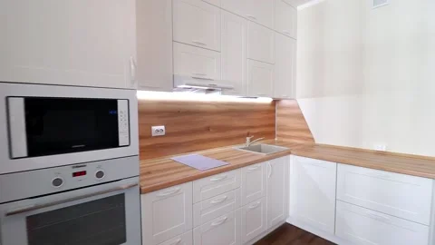 Details of a modern light kitchen in motion . View of the bright kitchen Video stock 141005262