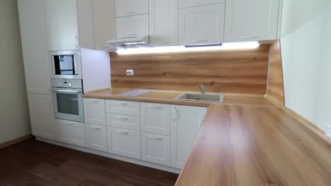 Details of a modern light kitchen in motion . View of the bright kitchen Video stock 141005294