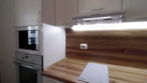 Details of a modern light kitchen in motion . View of the bright kitchen Video stock 141005466