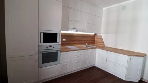 Details of a modern light kitchen in motion . View of the bright kitchen Video stock 141005521