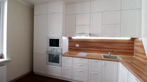 Details of a modern light kitchen in motion . View of the bright kitchen Video stock 141005552