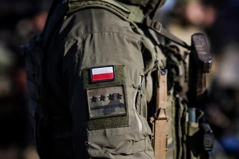Details with the patch of a Polish soldier. Stock Photos