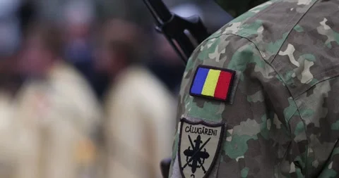 Details with the patch, uniform and weapon of a Romanian soldier 스톡 동영상 327612039