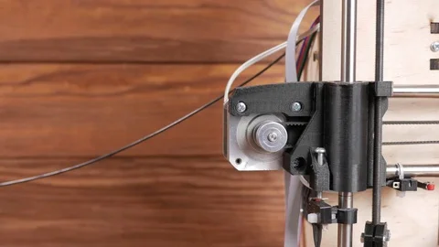 Details of the printer close-up. Stepper motors move the belt extruders. Close Stock Footage 77951205
