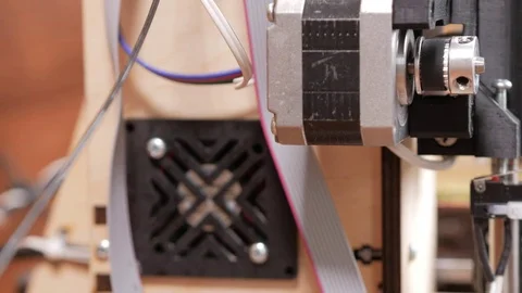 Details of the printer close-up. Stepper motors move the belt extruders. Close Stock Footage 77952451