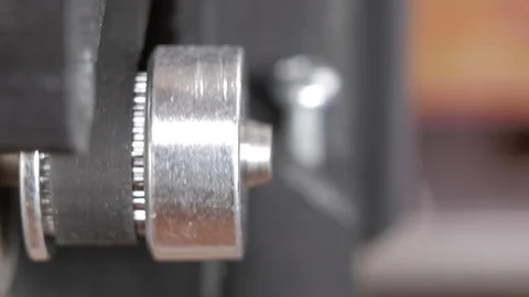 Details of the printer close-up. Stepper motors move the belt extruders. Close Stock Footage 77954084