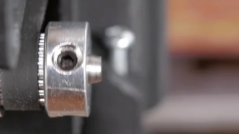 Details of the printer close-up. Stepper motors move the belt extruders. Close Stock Footage 77954268