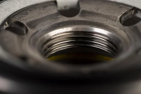 Details of a replaceable metal filter for cleaning engine oil in a car Stock Photos