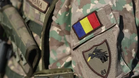 Details of a Romanian soldier with the flag patch on the uniform Stock Footage 321518856