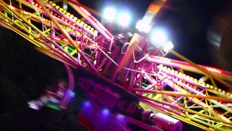 Details of rotating, highly colored carousel at night Stock Footage 80222039