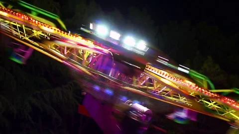 Details of rotating, highly colored carousel at night Stock Footage 80222050