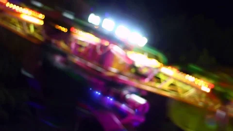 Details of rotating, highly colored carousel at night Stock Footage 80222059