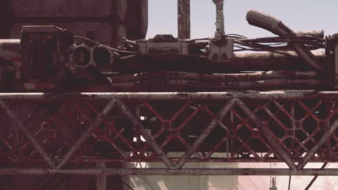 Details of a rusty machine in a factory setting with pipes and wires Stock Footage 343935840